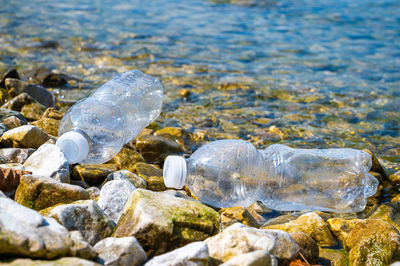 Plastic bottles abandoned on a beach. water pollution, microplastics, waste.