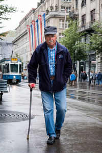 Portrait of man standing in city