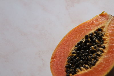 Close-up of orange slice against white background