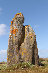 Menhir of toeno - lonely menhir on the coast at trebeurden in brittany, france