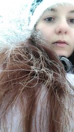 Close-up portrait of a girl looking away in winter