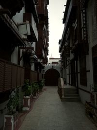 Narrow alley amidst buildings in town