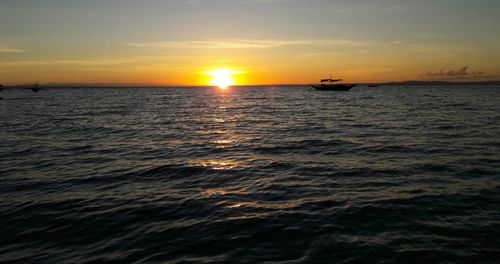 Scenic view of sea at sunset