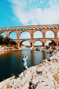 Tourists walking on riverbank