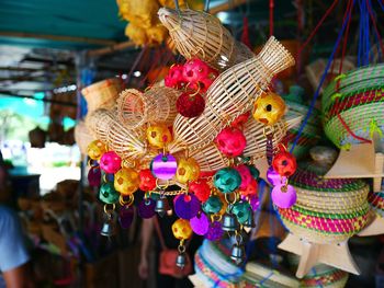 Close-up of multi colored toys hanging for sale in market