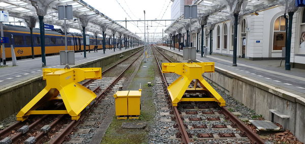 Yellow train on railroad tracks