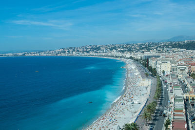 High angle view of sea and buildings against sky