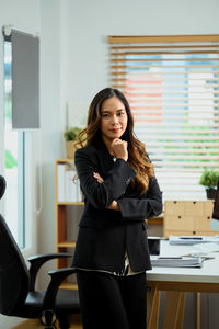 Portrait of young businesswoman working at cafe