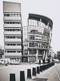 Buildings in city against clear sky