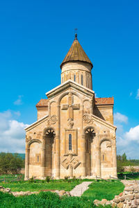 Low angle view of building against blue sky