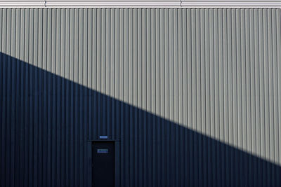 Full frame shot of fire exit door on corrugated iron