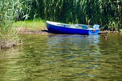 Boat moored in lake