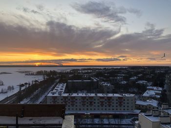 High angle view of buildings against sky during sunset