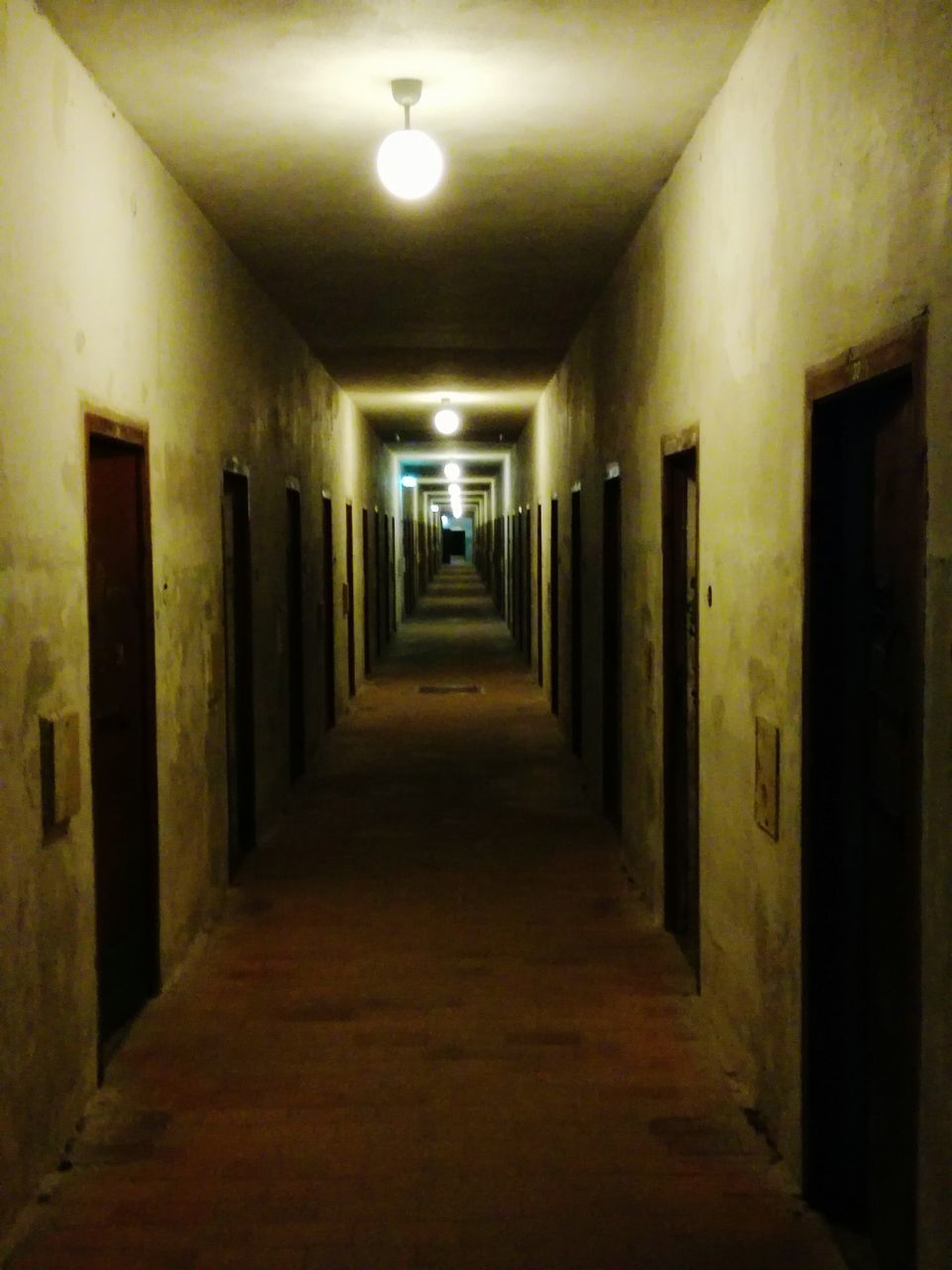 VIEW OF CORRIDOR IN ILLUMINATED ROOM