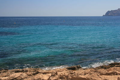 Scenic view of sea against clear sky