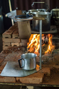 Close-up of meat cooking on barbecue grill at kitchen