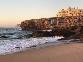 View of beach against sky during sunset