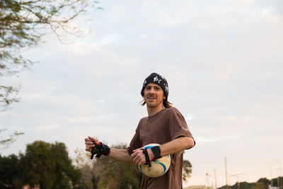 Portrait of young man with soccer ball