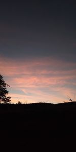 Scenic view of silhouette landscape against sky during sunset