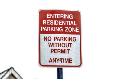 Close-up of road sign against white background