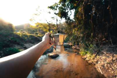 Person holding coffee cup