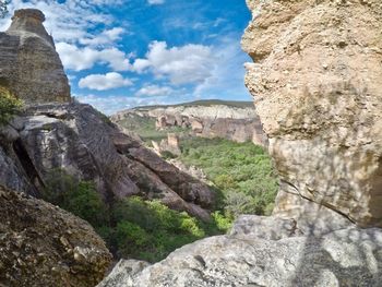 Scenic view of cliff against sky