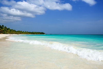 View of beach against cloudy sky