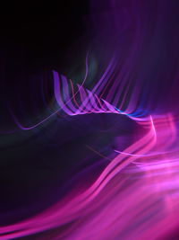 Close-up of light painting against black background