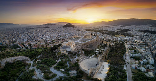 Aerial view of townscape against sky during sunset