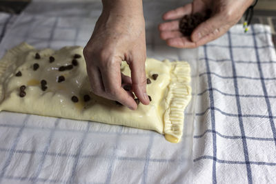 Midsection of person preparing food