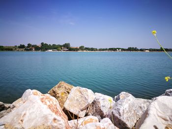 Scenic view of lake against blue sky