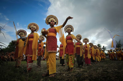 Balineese rejang dancer are dancing in the midle of ricefield at bungaya village