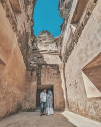 People standing at historical building