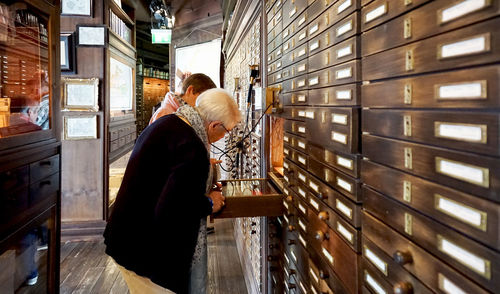 Low angle view of man working in store