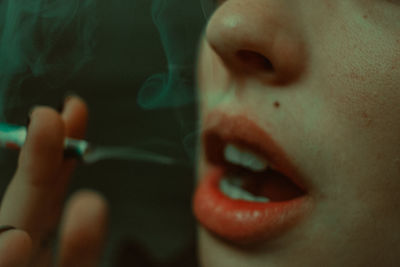 Close-up of woman smoking cigarette