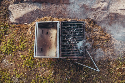 Old rusty metal on field