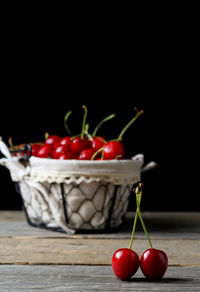 Close-up of tomatoes on table against black background