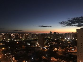 Aerial view of city lit up at night