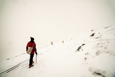 Full length of woman standing against clear sky