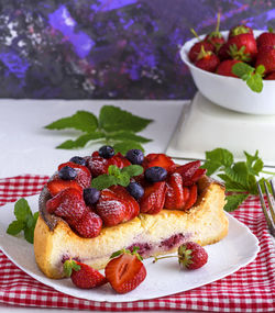 Close-up of strawberries in plate on table