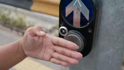 Cropped hand of person using mobile phone