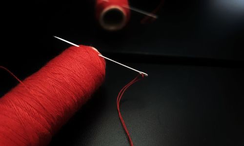 Close-up of red thread spool