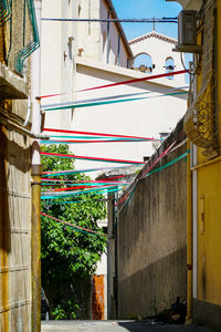 Low angle view of multi colored alley amidst buildings