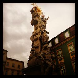 Low angle view of statue against sky