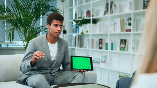 Young man using digital tablet