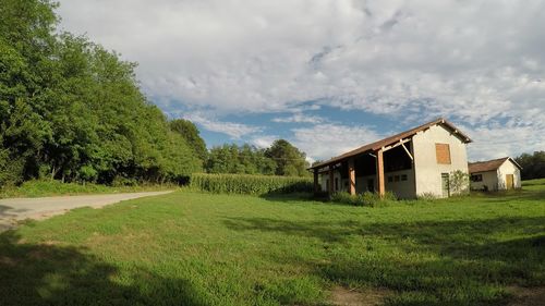 House on field against sky