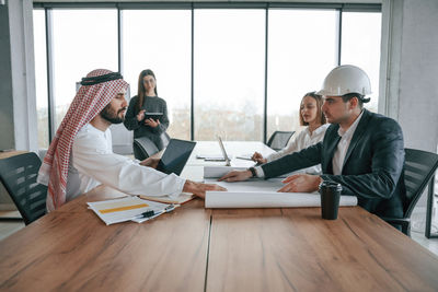 Business colleagues working in office