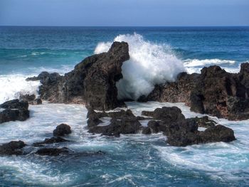 Waves splashing on rocks at shore