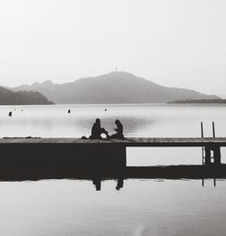 Scenic view of lake with mountains in background