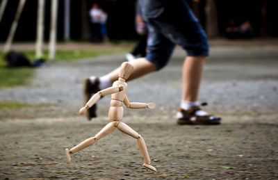 Close-up of wooden figurine at park